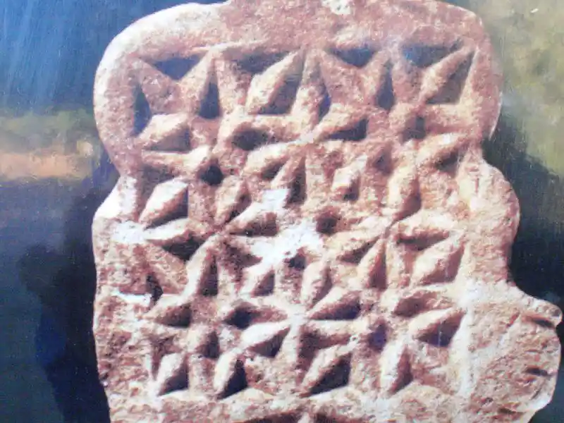 Ancient tombstone (Mezar Tasi) with geometric star and diamond relief carvings
